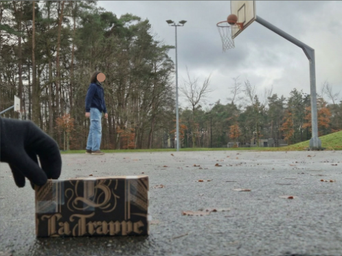 A player practising a basketball shot outdoors